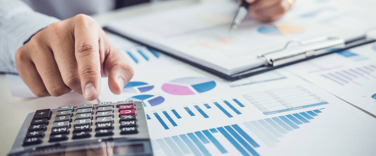 Accountant calculating cash flow and liquidity to support commercial loan planning decisions