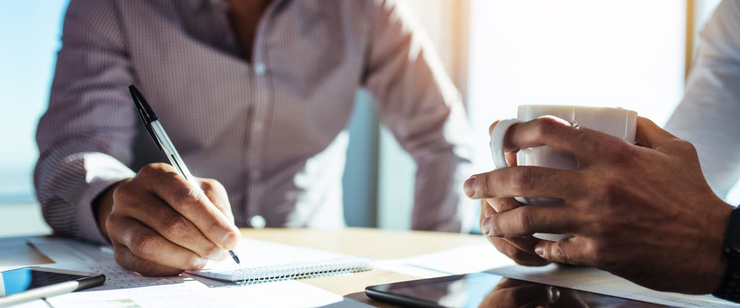 Business loan broker discussing loan terms with lenders and clients