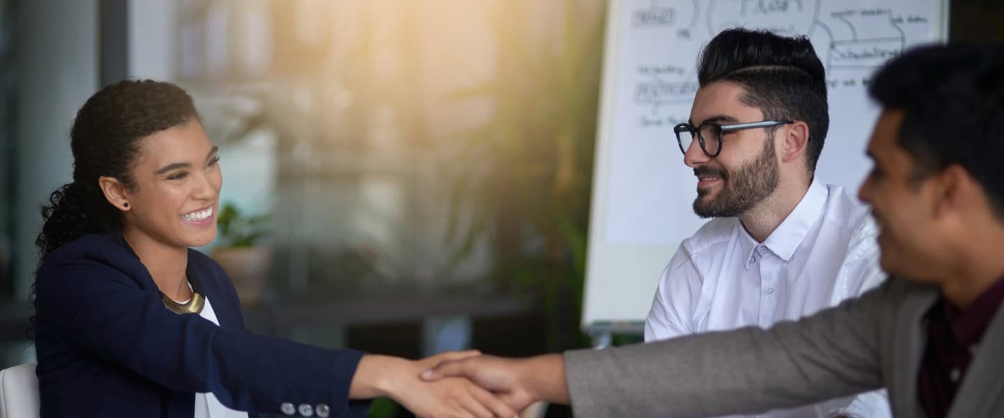 Mortgage broker finalizing a commercial lending agreement with partners