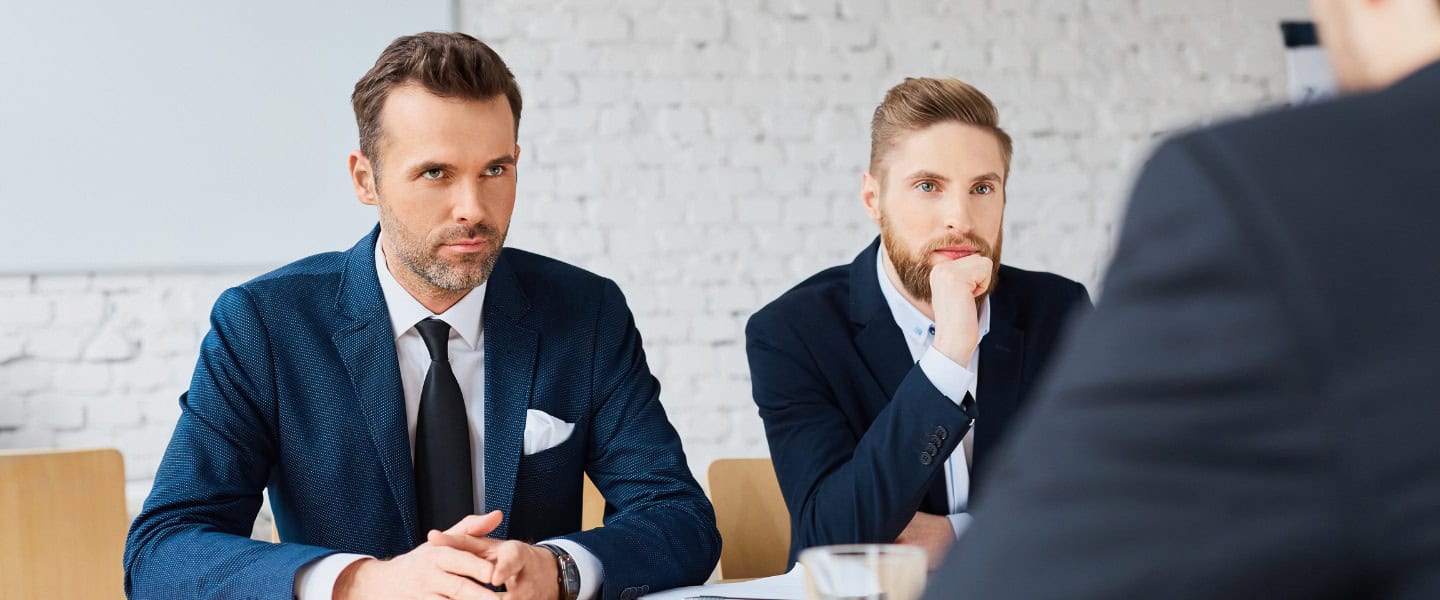 Commercial loan brokers meeting with business client about financing trends