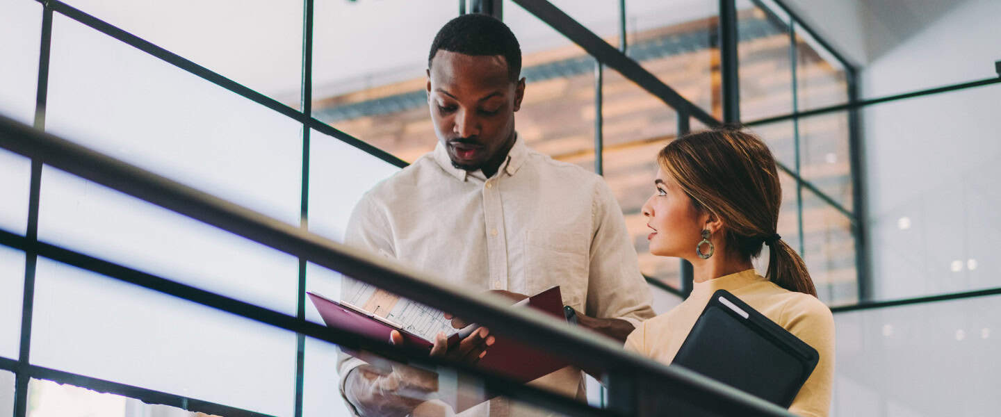 Loan professionals reviewing commercial financing documents