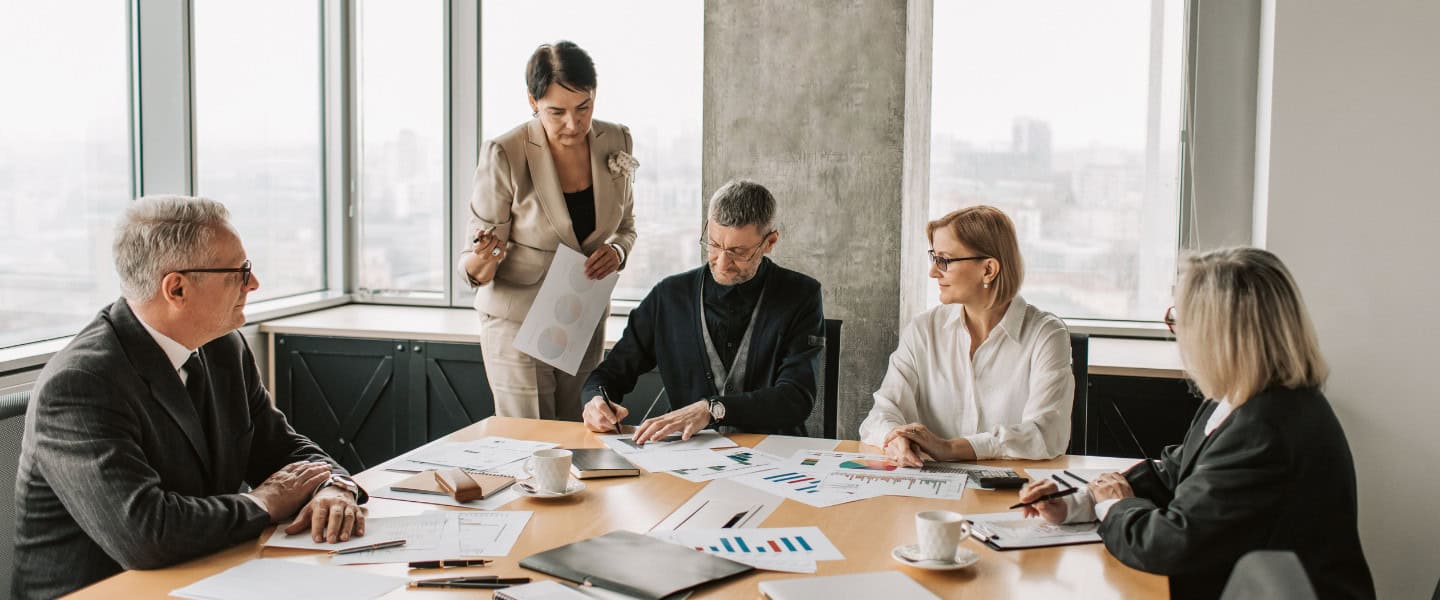 Broker team discussing a completed loan deal