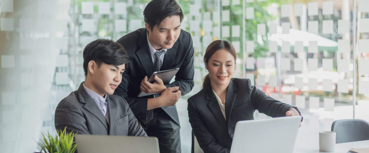 Business loan broker explaining loan options to business owners