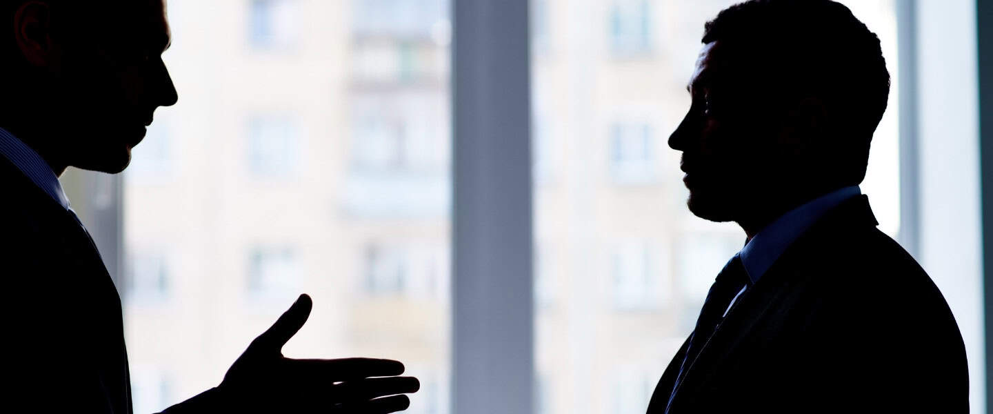 professionals discussing banker to broker career change